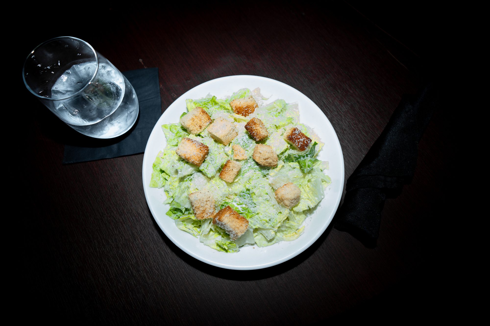 Classic Caesar salad with shaved parmesan and croutons