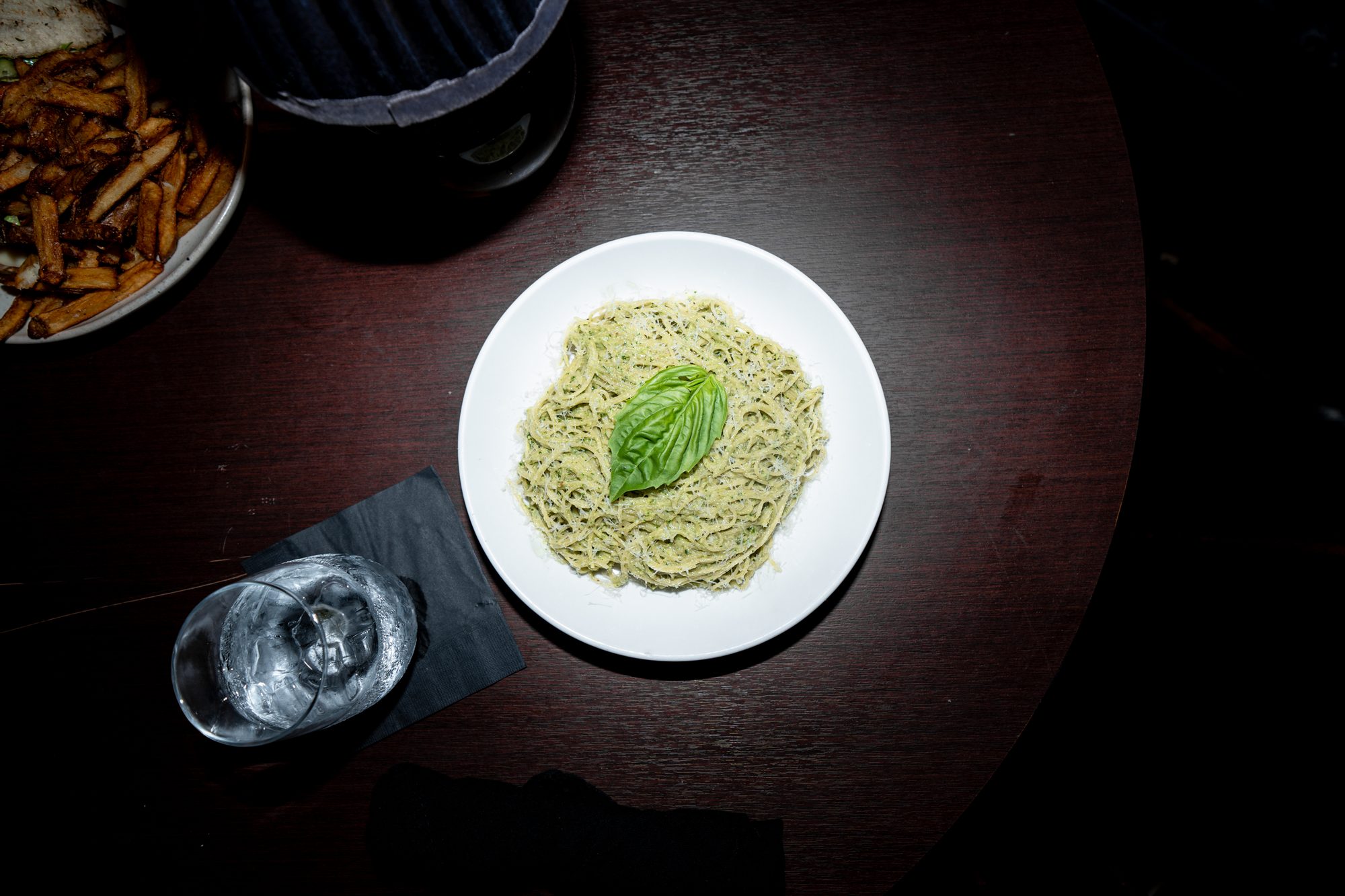 Pasta dish plated under warm lamp light