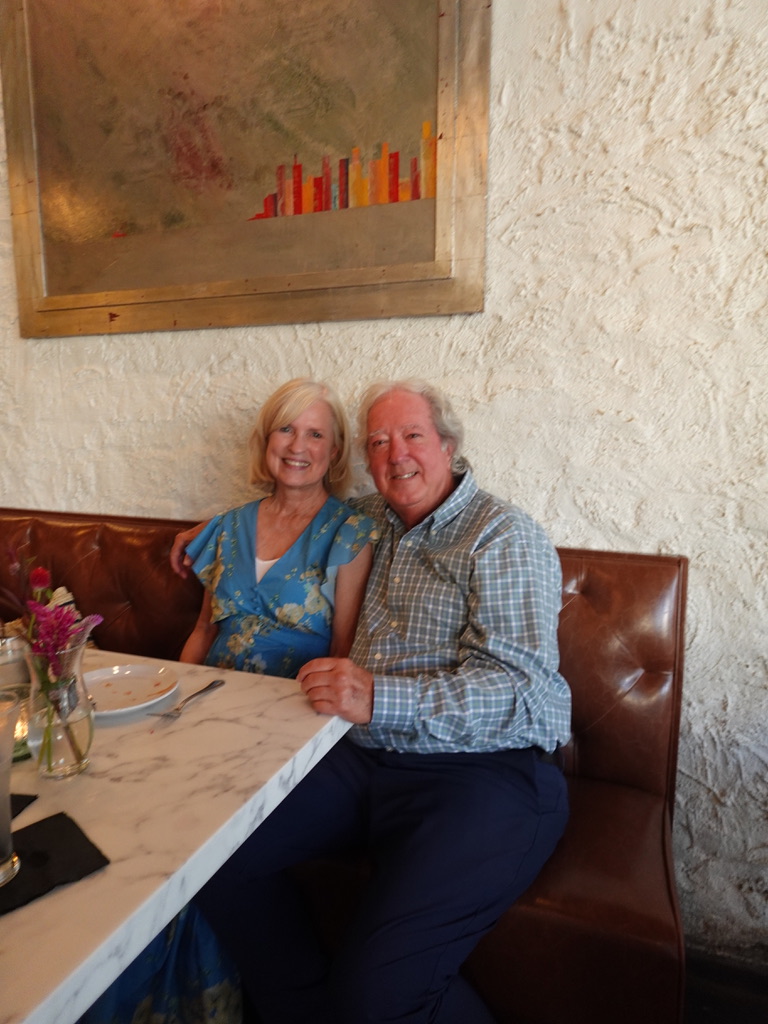 Guests enjoying daylight at a dining booth