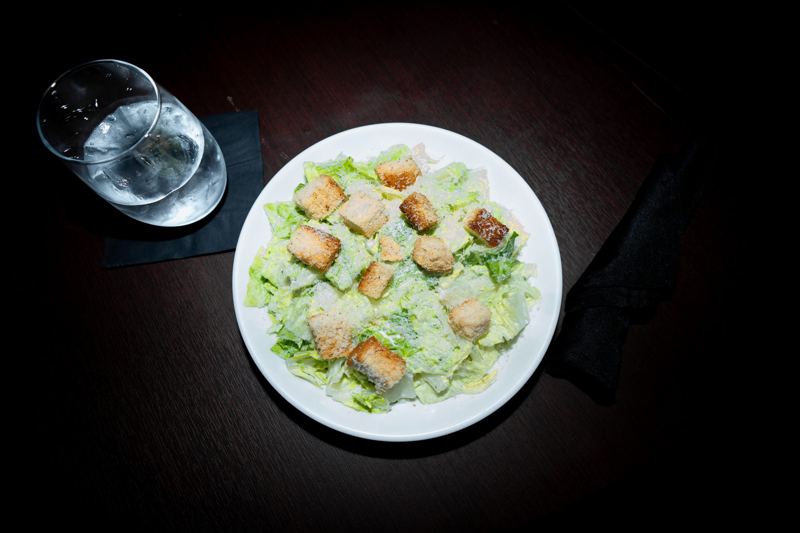 Classic Caesar salad with shaved parmesan and croutons